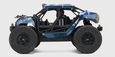 Hurricane Rock Rocker med blå karrosse og offroad hjul set fra siden med hvid baggrund 