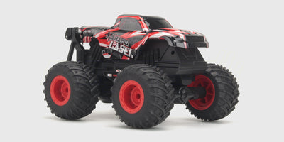 Orange Firedance Stunt Truck fjernstyret bil med store skumhjul og 360-graders spin-funktion på hvid baggrund.